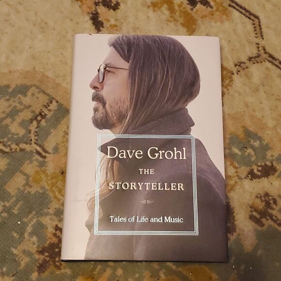 The Storyteller: Tales of Life and Music is a memoir by Dave Grohl, the drummer - Picture 1 of 8